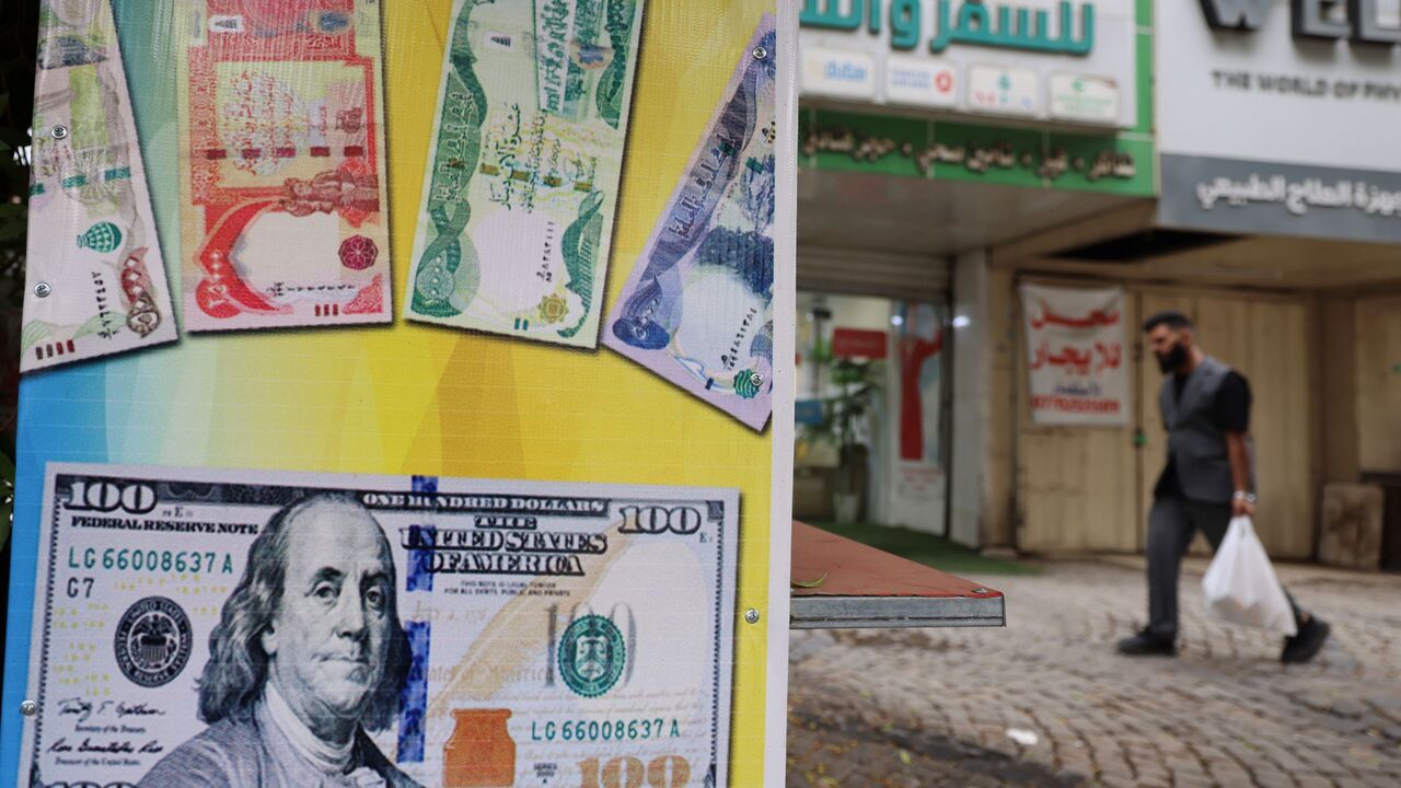 Iraq devalues dinar as oil-export disruption strains public finances